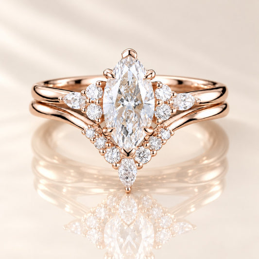 Front view of a rose gold marquise bridal ring set with a curved wedding band