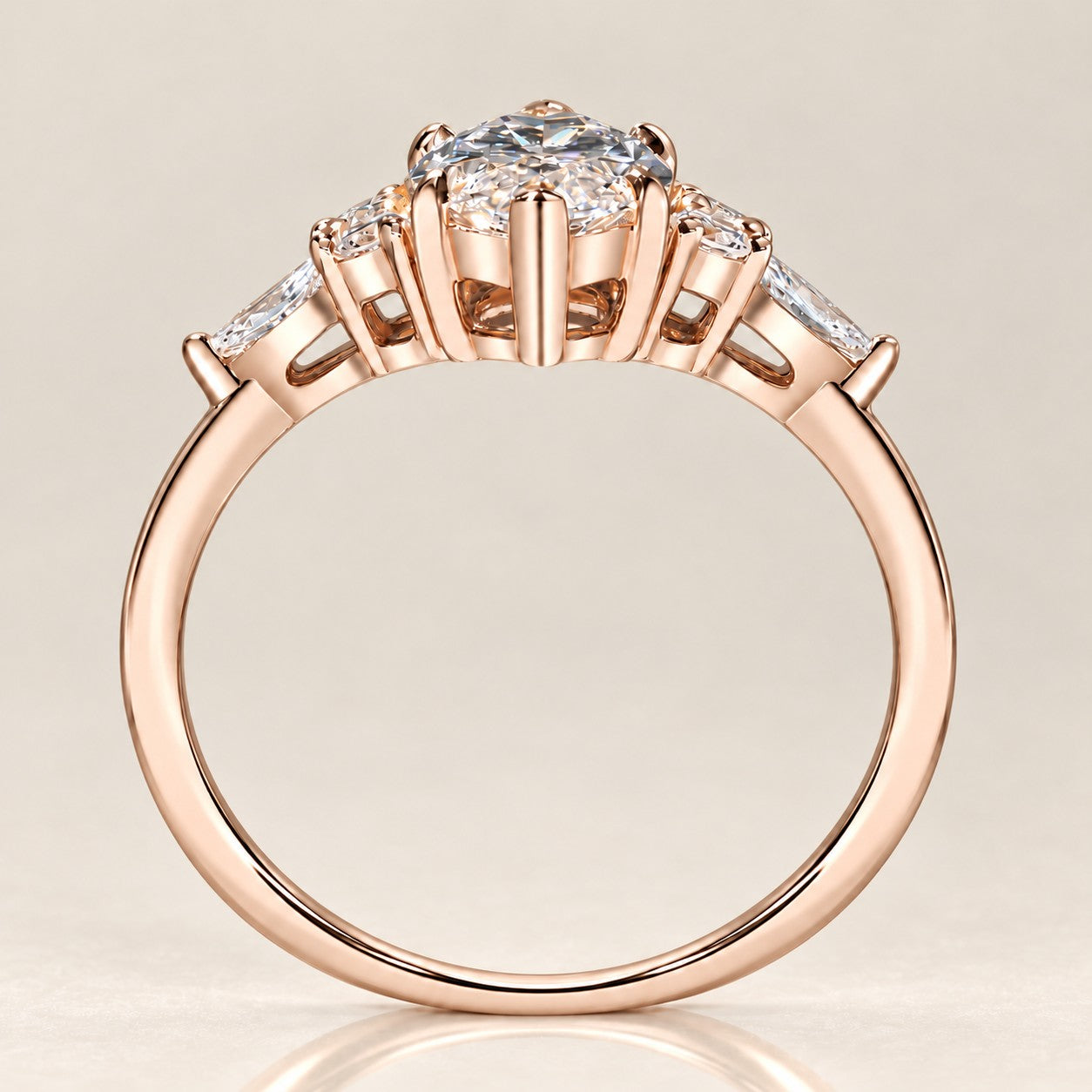 Elevated view of a rose gold marquise bridal ring set with a curved stone-set wedding band