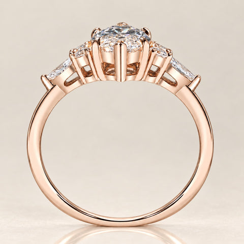 Elevated view of a rose gold marquise bridal ring set with a curved stone-set wedding band