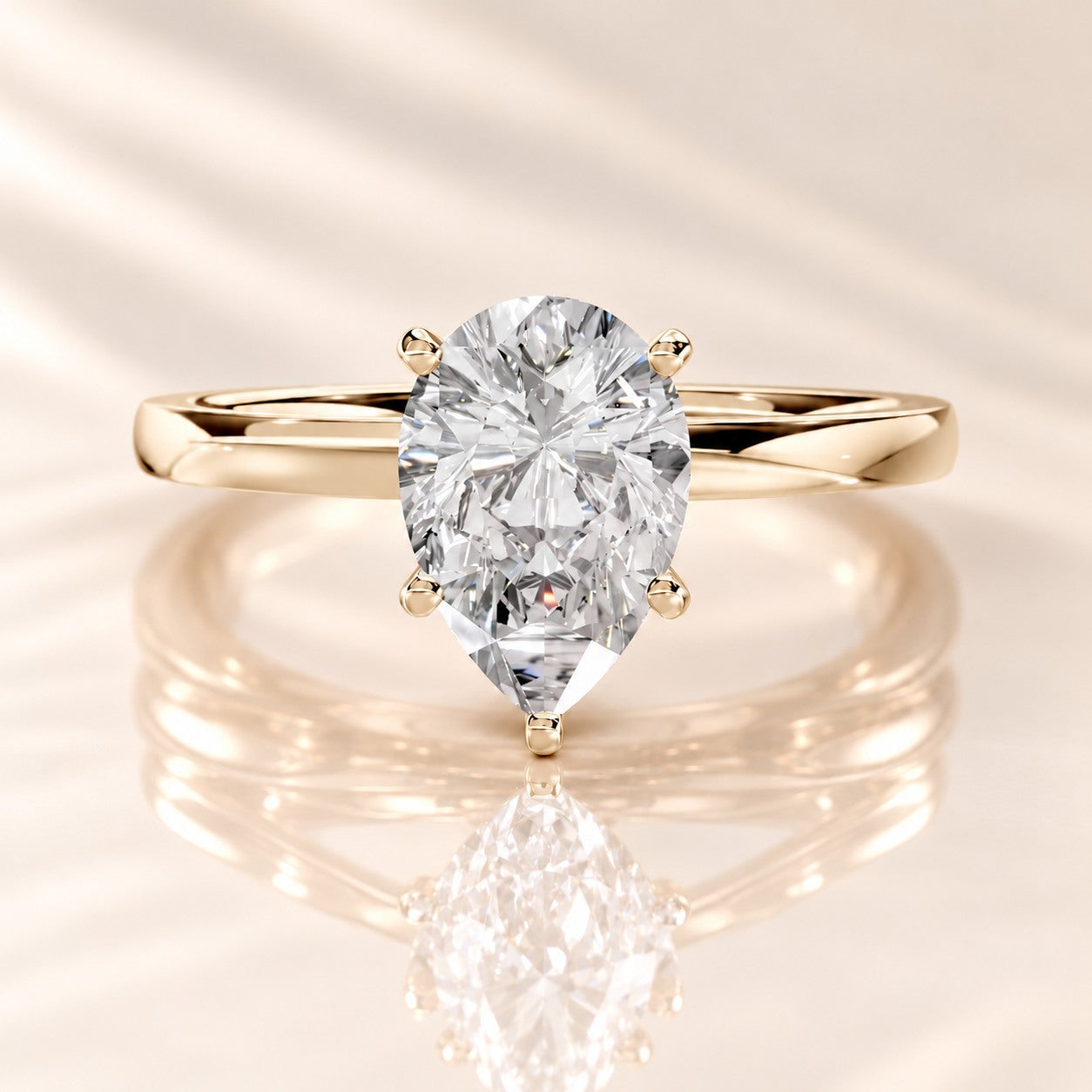 Front view of the UL-0004 pear lab-grown diamond solitaire ring in 14K yellow gold